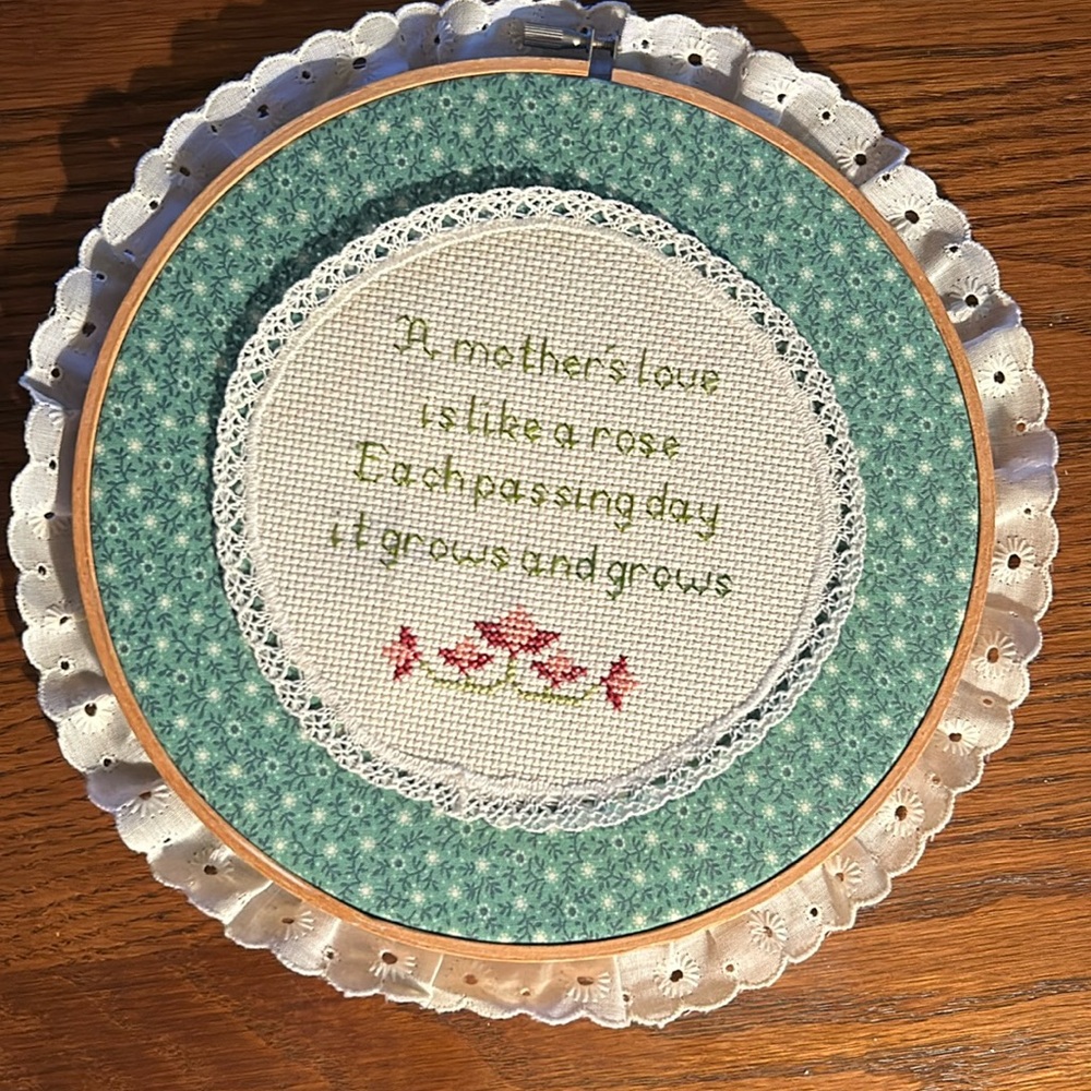 “A Mother’s Love” crossstitch, 9.5” diameter. Handmade, ready to hang. Lace edge